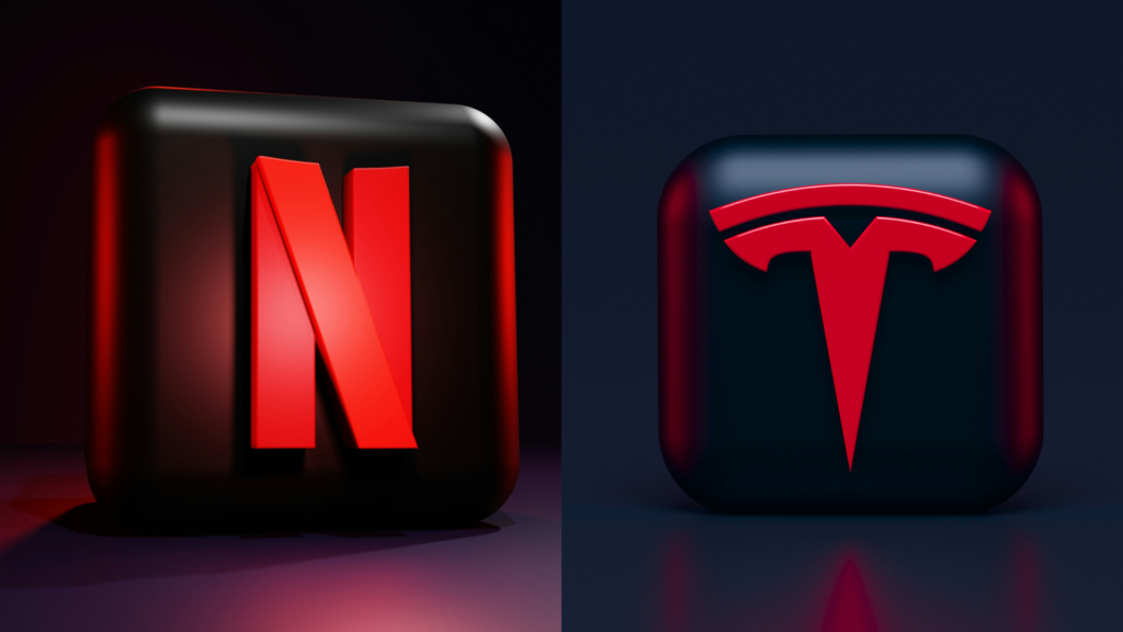 Red logos of Netflix and Tesla symbolizing energy, passion, and urgency in brand identity, capturing attention and stimulating excitement in consumers.