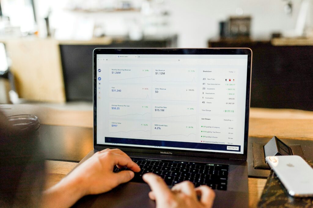 Laptop displaying sales data and analytics, illustrating the process of measuring the impact of your brand's story.