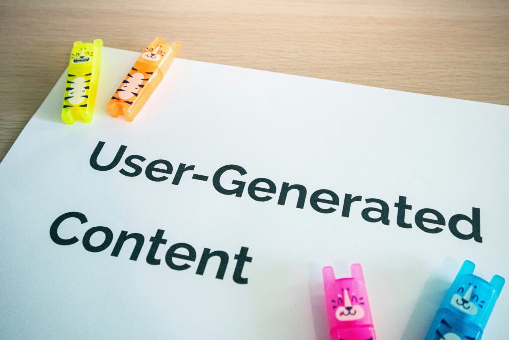 "UGC" text representing User-Generated Content, highlighting customer participation in brand storytelling.