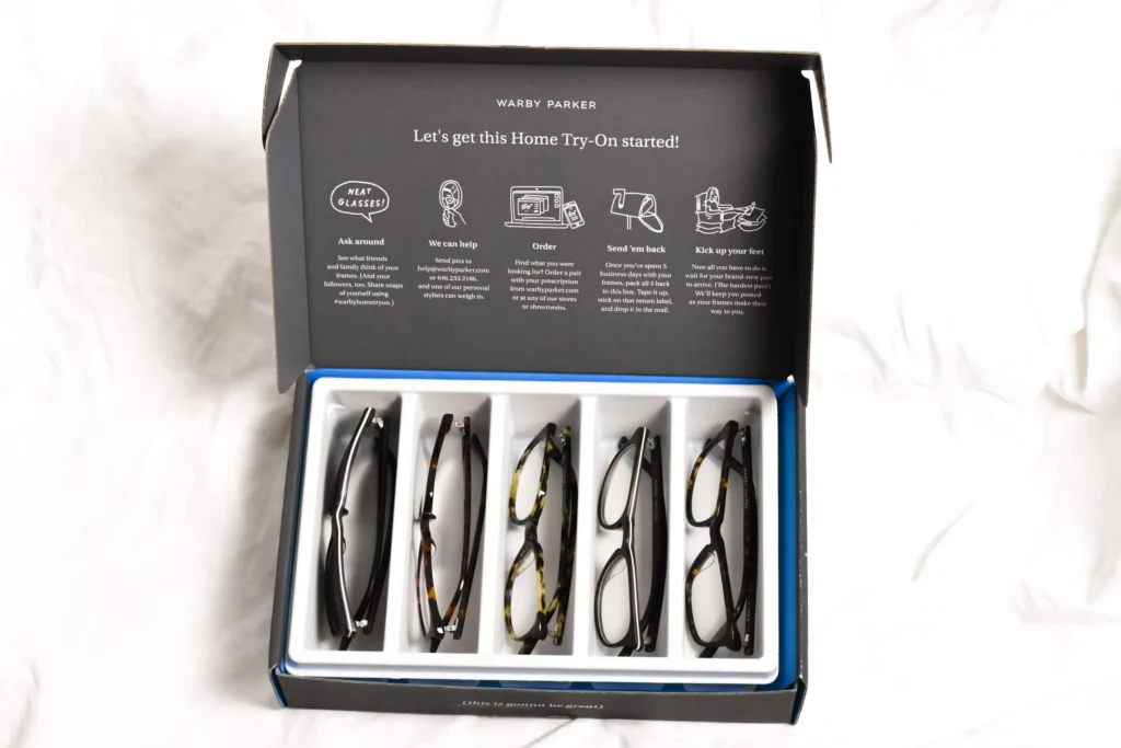 A stylish Warby Parker eyewear box featuring elegant branding and thoughtful design elements, showcasing the brand's commitment to quality and customer experience.