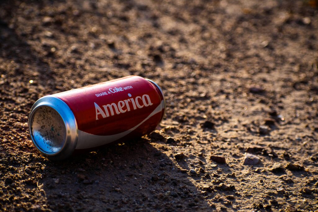 Coca-Cola can featuring the phrase "Share a Coke" prominently displayed on the label.