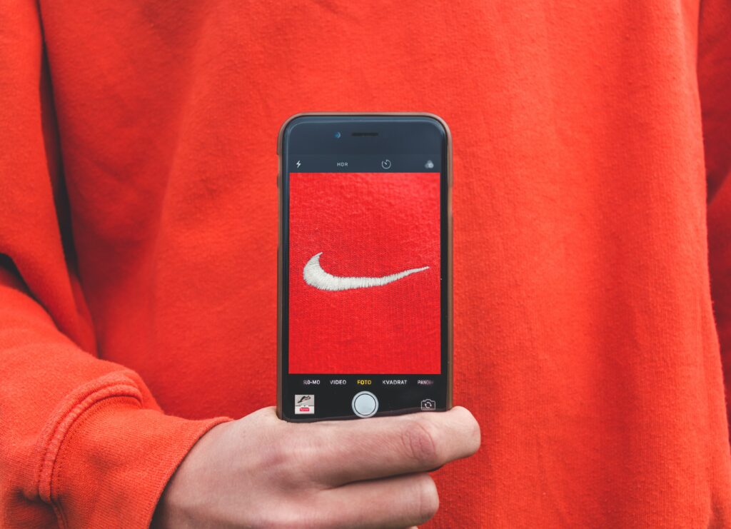 A Nike logo representing the brand's customer-centric approach.