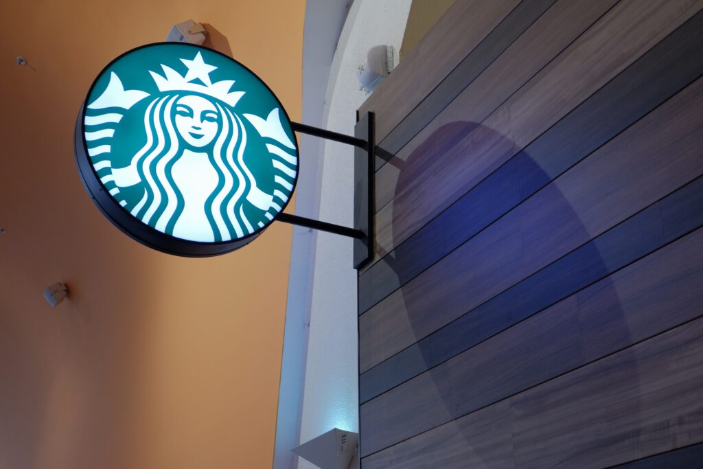 Starbucks logo prominently displayed outside a Starbucks store.