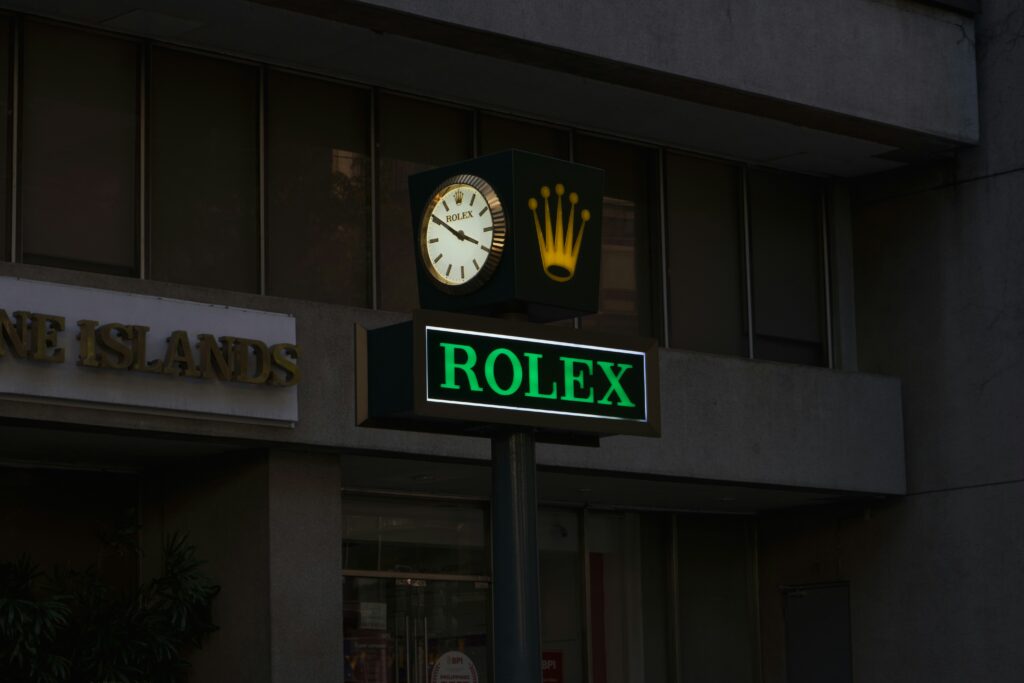 Exterior view of a Rolex store, showcasing its luxurious design and branding.