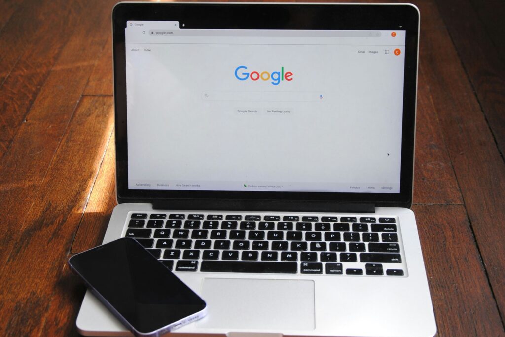 Google search homepage displayed on a computer screen, showcasing its minimalist design with a simple logo and search bar.