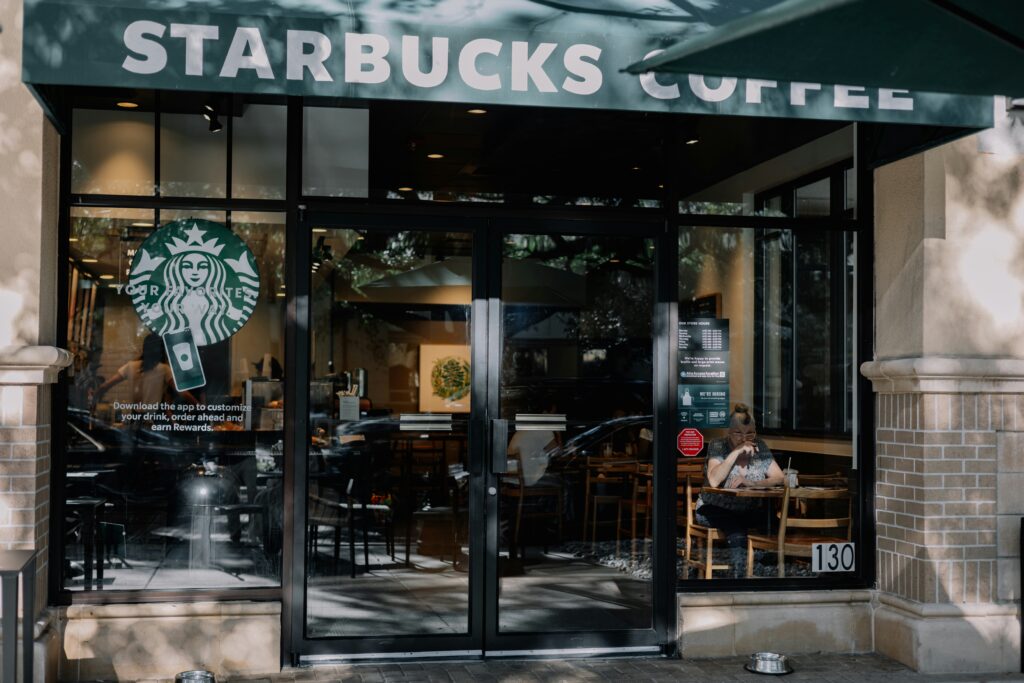 Exterior view of a Starbucks store with its iconic logo prominently displayed.