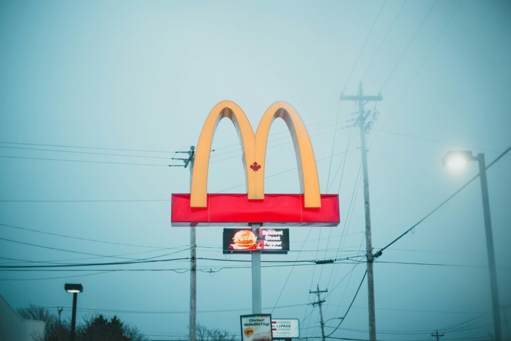 McDonald's Golden Arches logo, an iconic symbol of fast food culture.