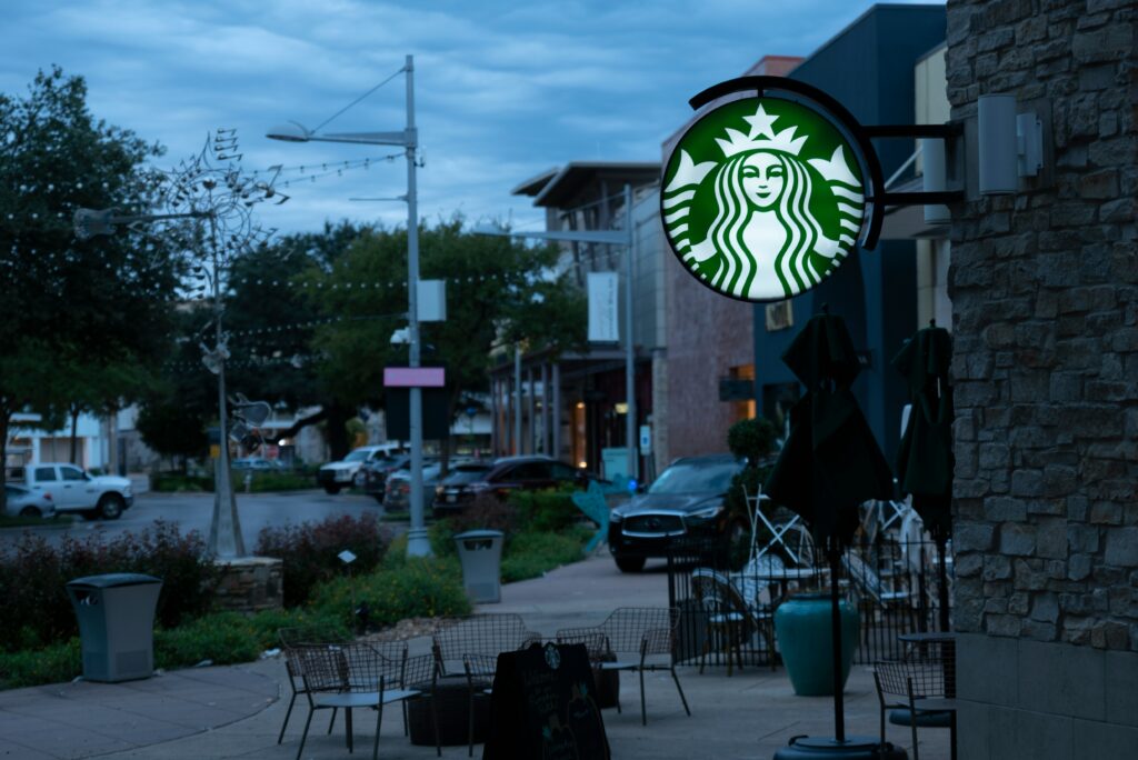 Starbucks store exterior featuring the iconic Siren logo, inviting customers into a world of coffee culture and indulgence.