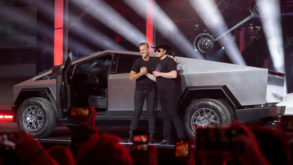 Elon Musk at the Tesla Cybertruck launch, demonstrating effective buzz marketing through innovative design and event strategy.