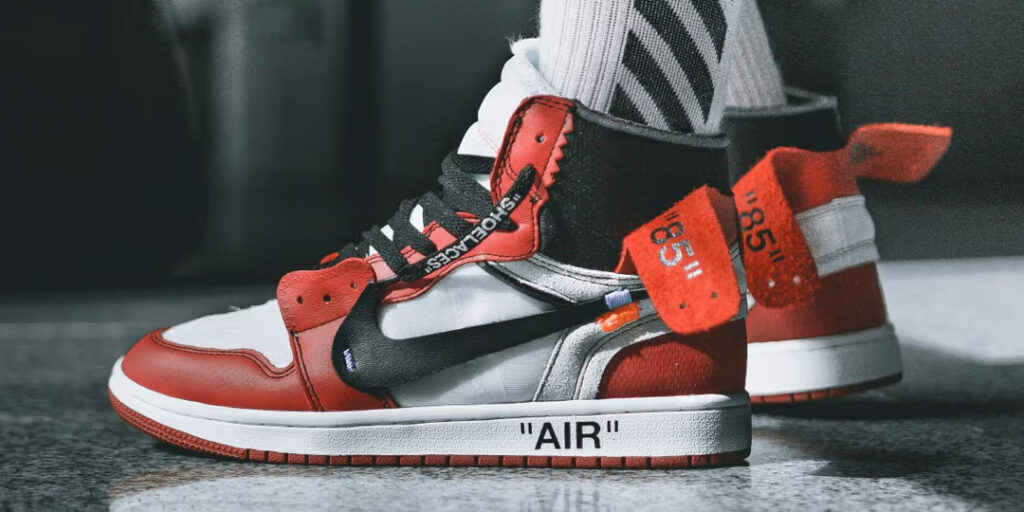 A close-up of the Nike x Off-White shoe in red, white, and black colors, showcasing the unique design elements of the collaboration.